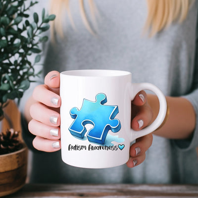 a woman holding a coffee mug with a puzzle piece on it