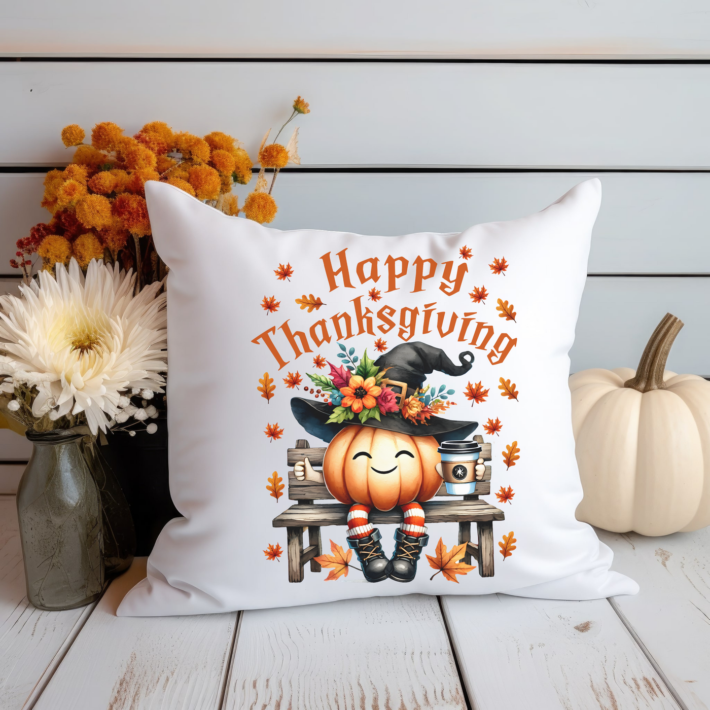 a white pillow with a happy thanksgiving pumpkin on it