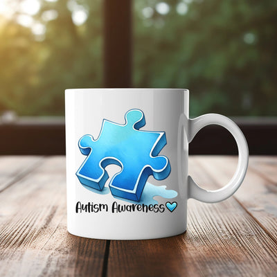 a white coffee mug with a blue puzzle piece on it