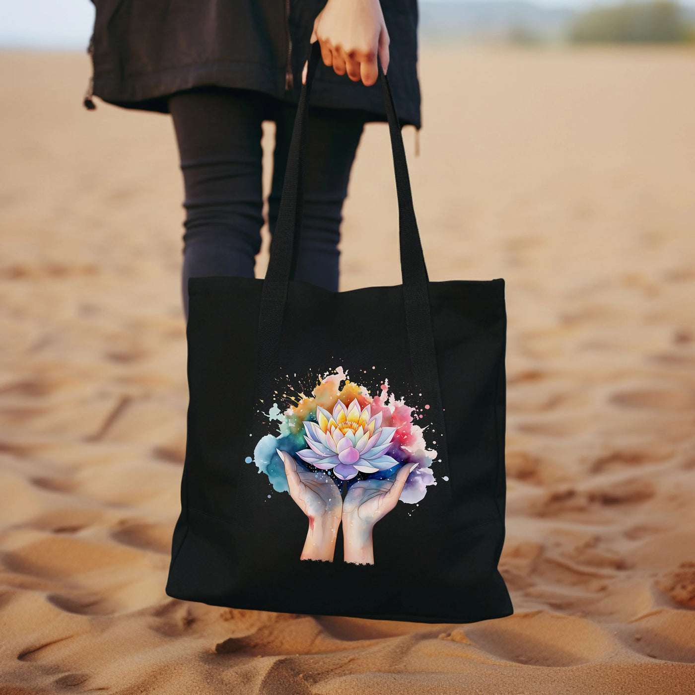 a woman holding a black bag with a flower on it