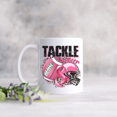 a white coffee mug with a football helmet and a pink heart on it