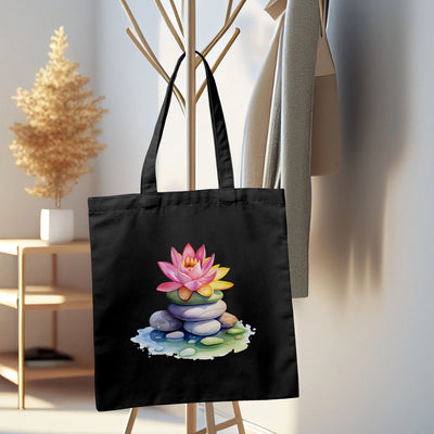 a black tote bag with a picture of a lotus flower on it