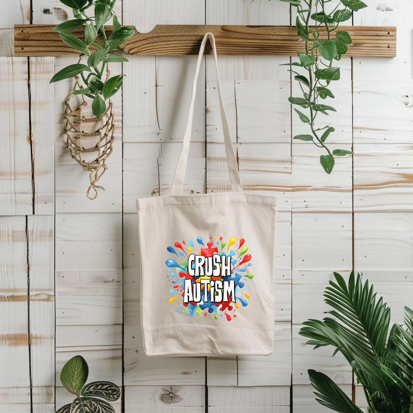 a tote bag hanging on a wall next to a potted plant