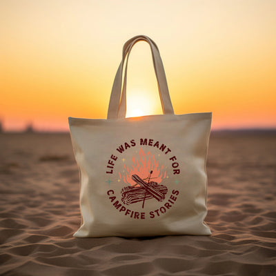 a white bag sitting on top of a sandy beach