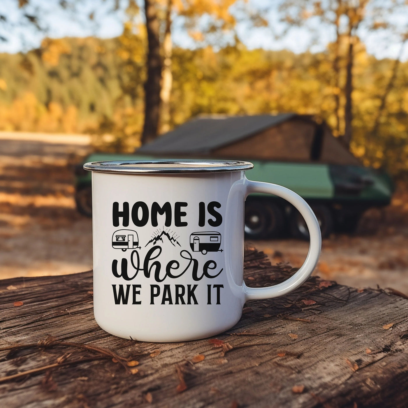 a camper mug sitting on top of a tree stump