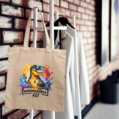 a tote bag hanging on a rack next to a brick wall