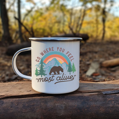 a white coffee mug sitting on top of a piece of wood