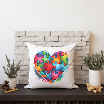 a pillow with a heart made of puzzle pieces