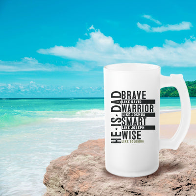 a white coffee mug sitting on top of a beach