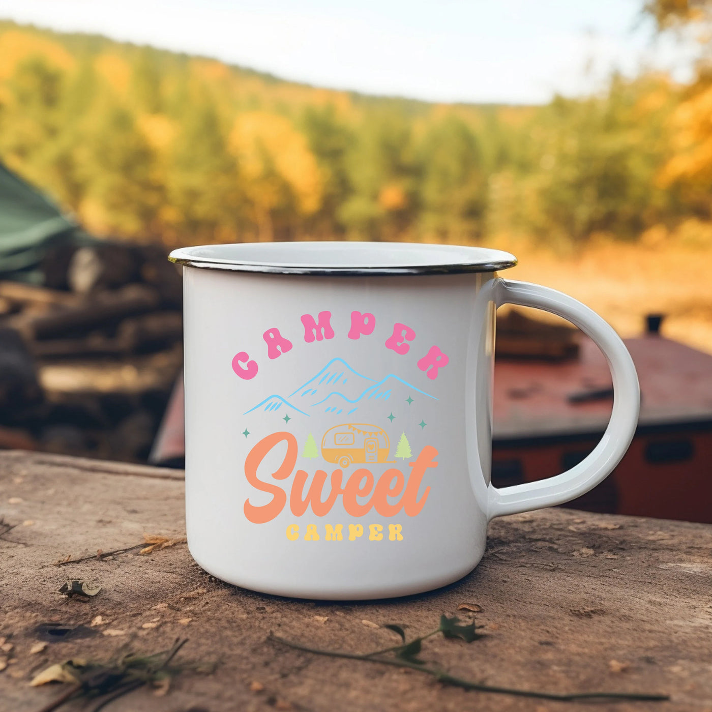 a camper mug sitting on top of a wooden table