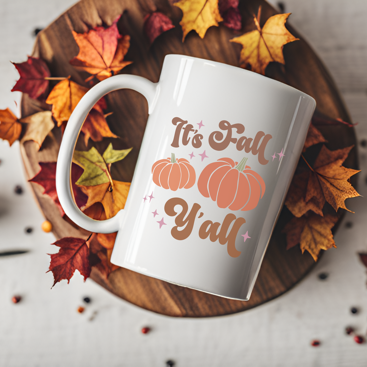 a coffee mug that says it's fall y'all