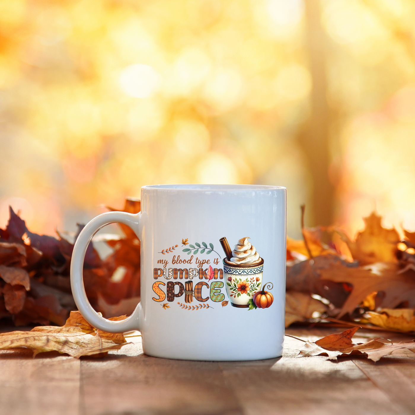 a white coffee mug sitting on top of a wooden table