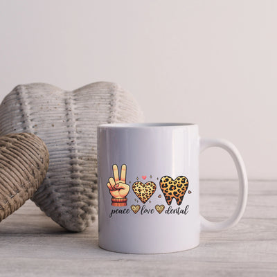 a white coffee mug sitting on top of a wooden table