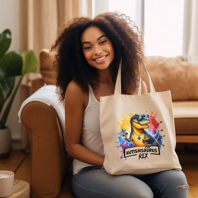 a woman sitting on a couch holding a tote bag