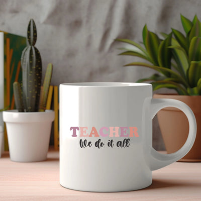 a white coffee mug with the words teacher we do it all