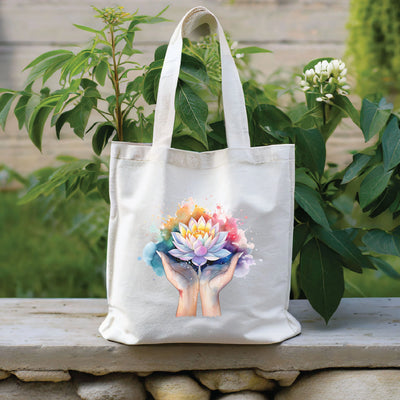 a white tote bag with a picture of a hand holding a bouquet of flowers