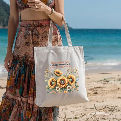 a woman standing on a beach holding a white bag