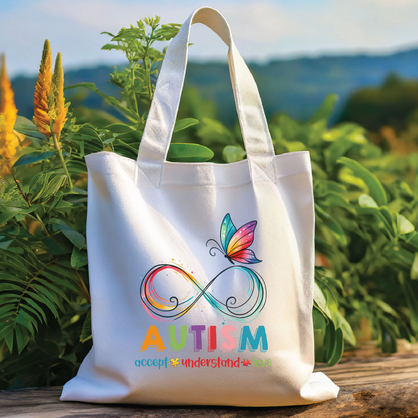 a white tote bag with a butterfly on it