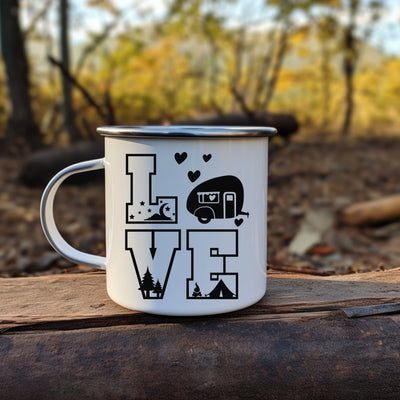 a camper mug sitting on top of a piece of wood