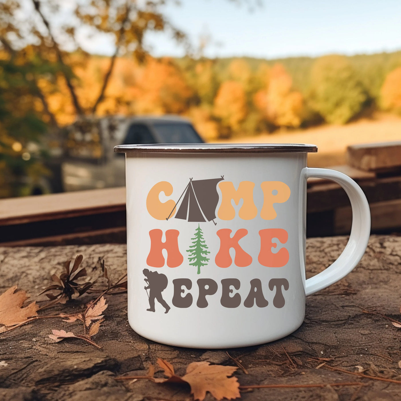 a camp coffee mug sitting on the ground