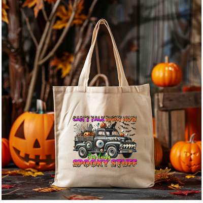 a canvas bag with a truck and pumpkins in the background