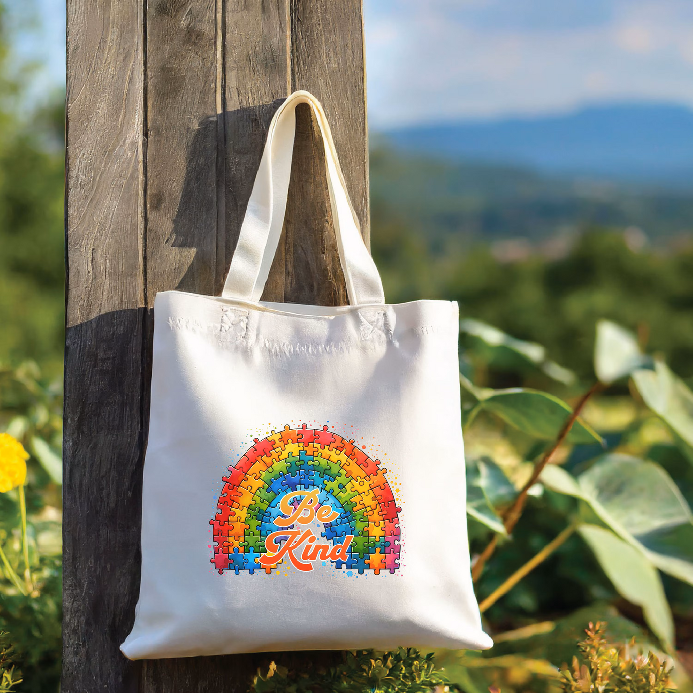 a white tote bag hanging from a wooden pole