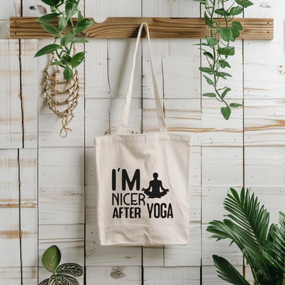 a tote bag hanging on a wall next to a potted plant