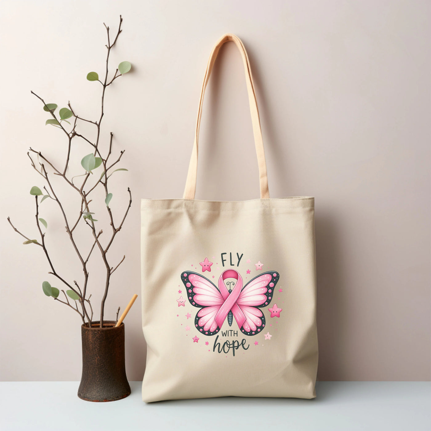 a tote bag with a pink butterfly on it