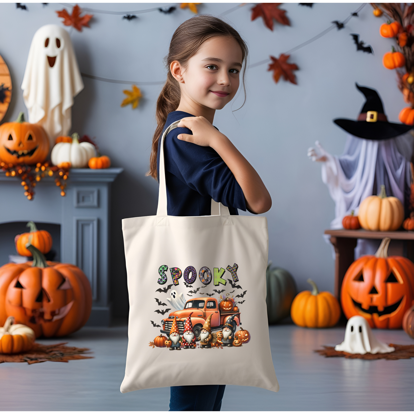 a little girl holding a trick or treat bag