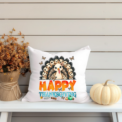 a happy thanksgiving pillow sitting on a bench next to a potted plant