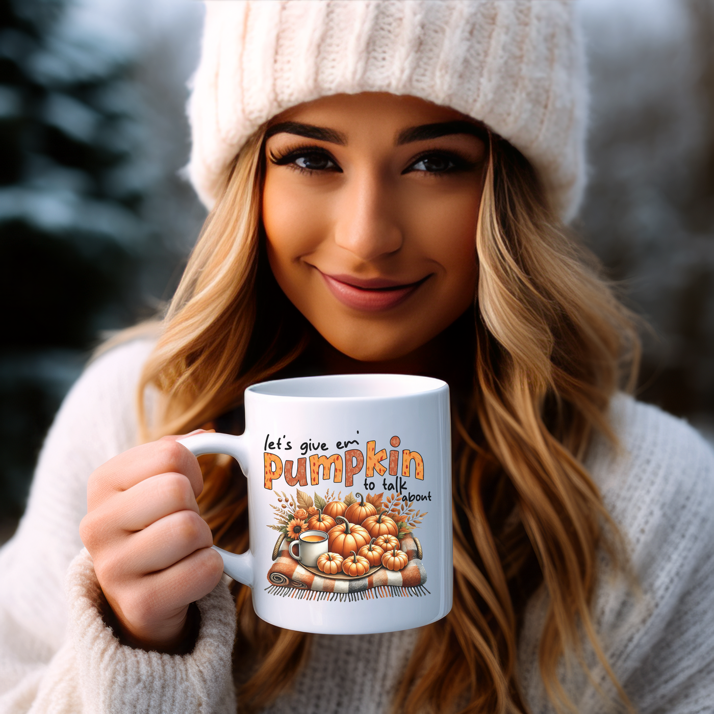 a woman holding a coffee mug with a picture of a pumpkin on it