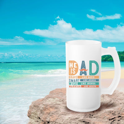 a white coffee mug sitting on top of a beach