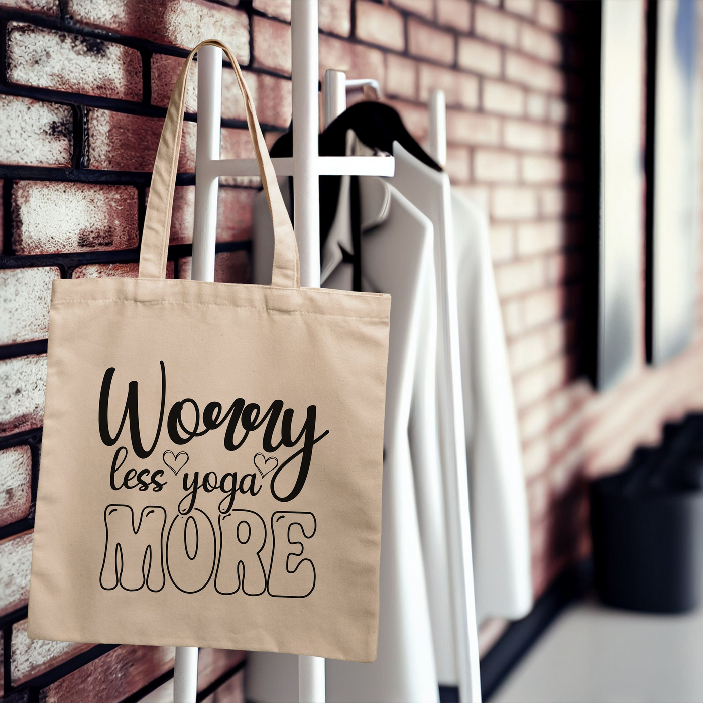 a tote bag hanging on a brick wall