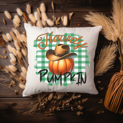 a white pillow with a happy pumpkin on it