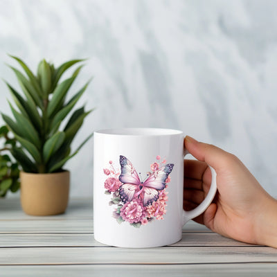 a person holding a coffee mug with a butterfly on it