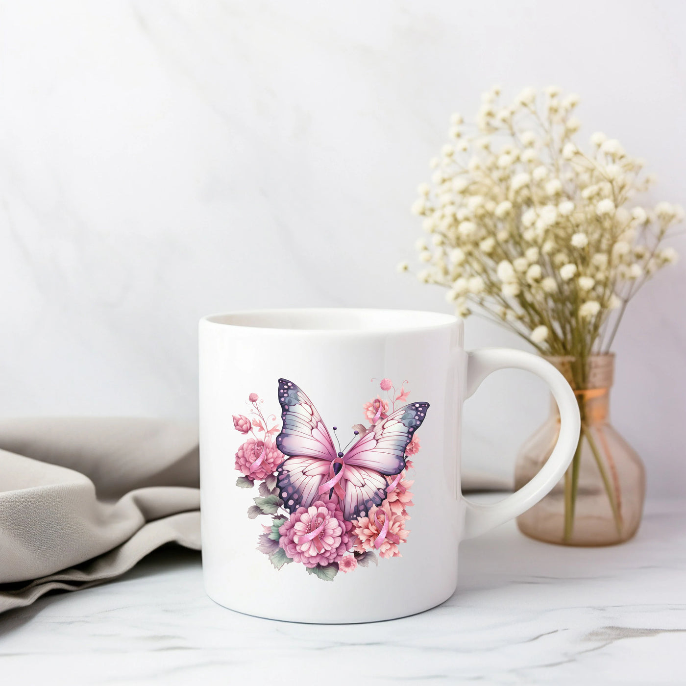 a white coffee mug with a pink butterfly on it