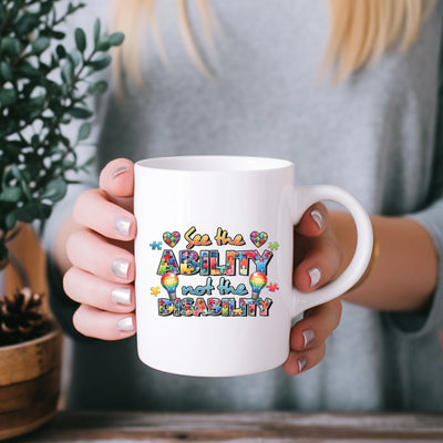 a woman is holding a coffee mug with the words ability on it