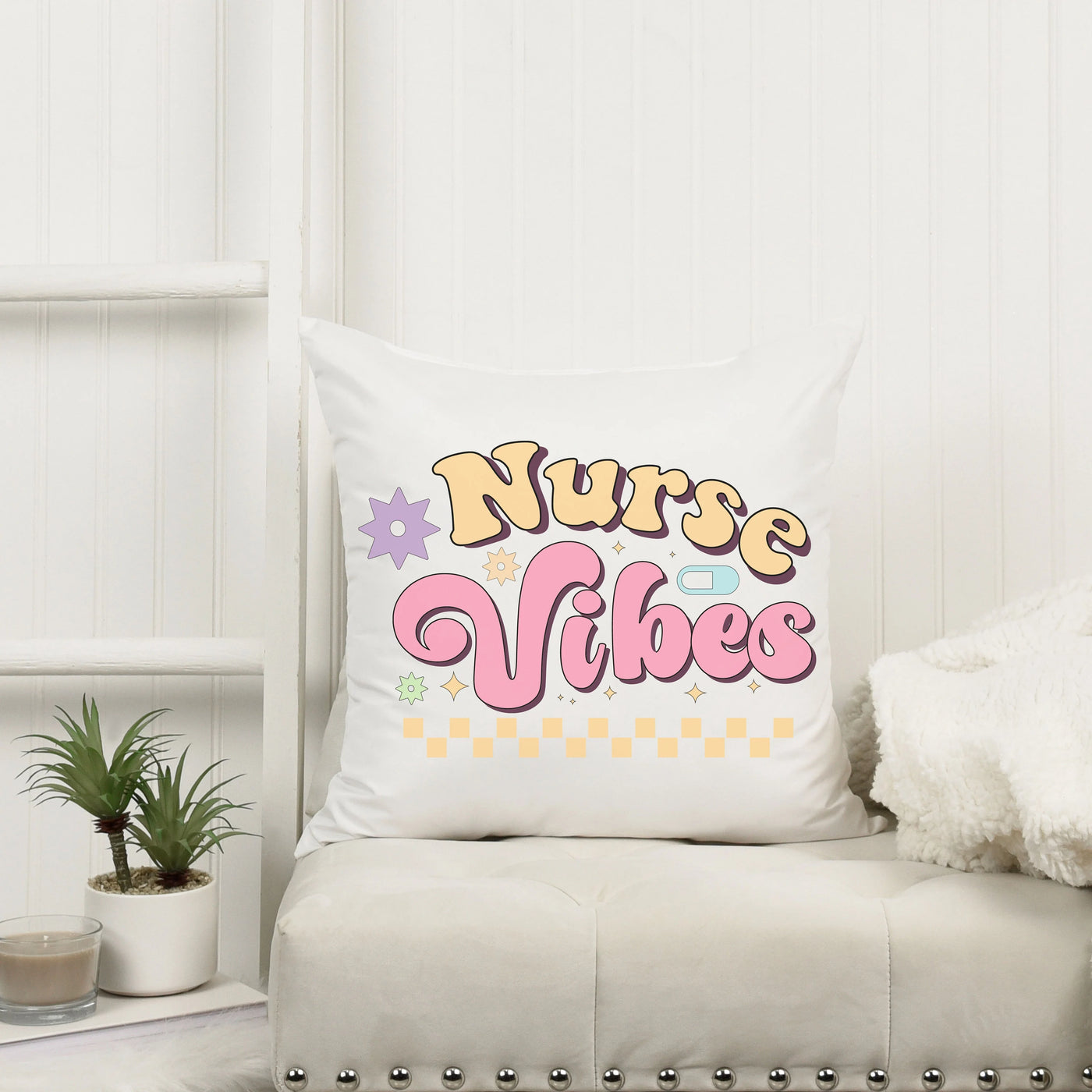 a white couch with a pillow that says nurse vibes