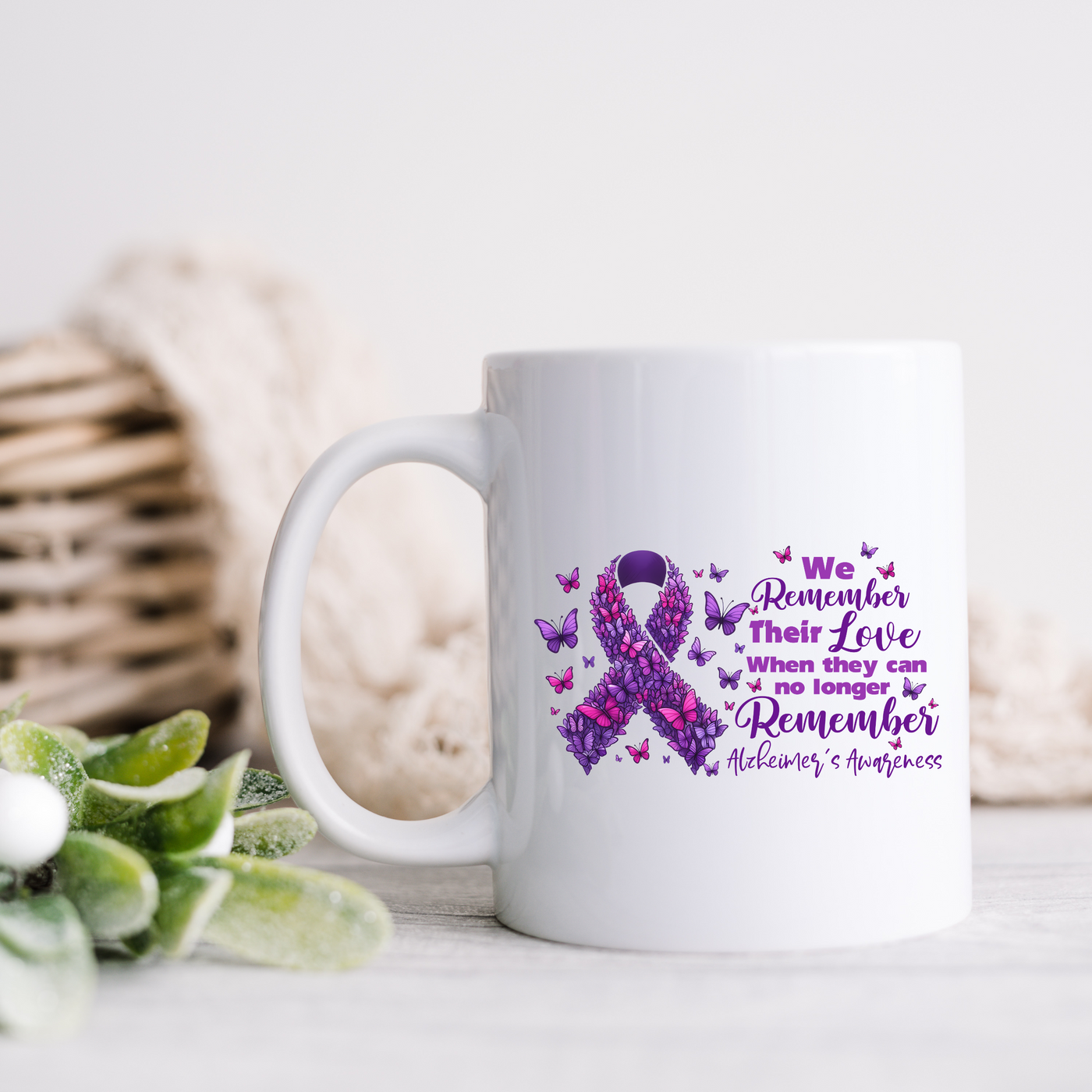 a white coffee mug with a purple ribbon on it