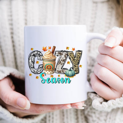 a woman holding a coffee mug with the word sasy on it