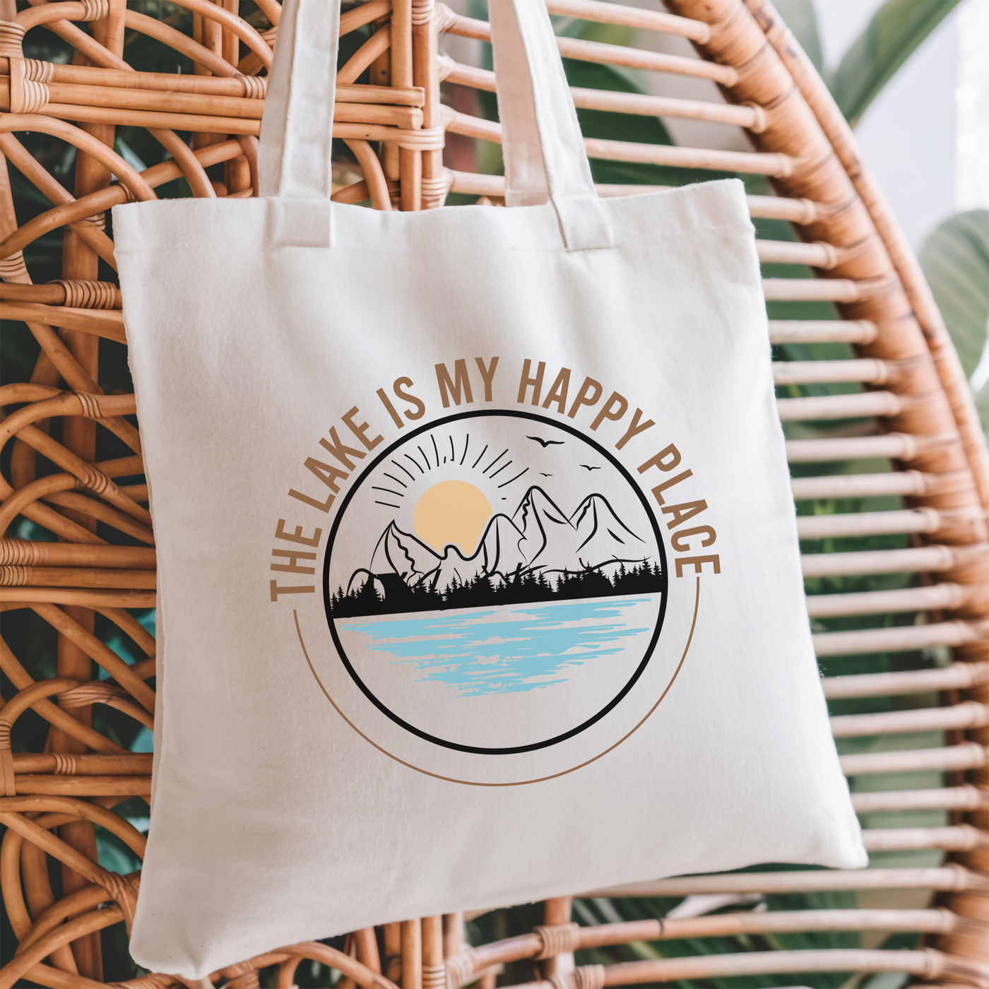 a white tote bag sitting on top of a wicker chair