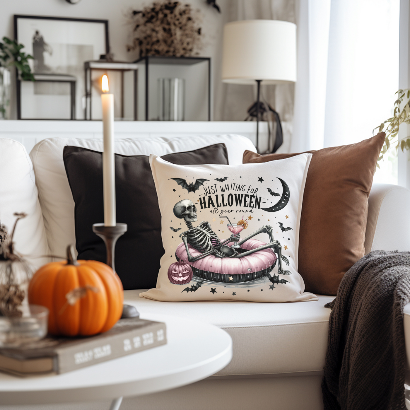 a white couch with a halloween pillow on it