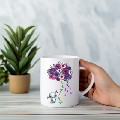 a person holding a coffee mug with flowers on it