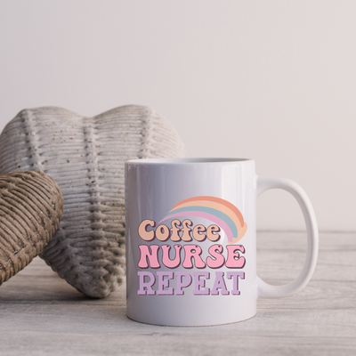 a coffee mug sitting next to a knitted heart