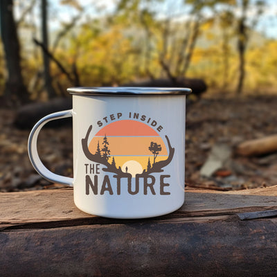 a white coffee mug sitting on top of a piece of wood