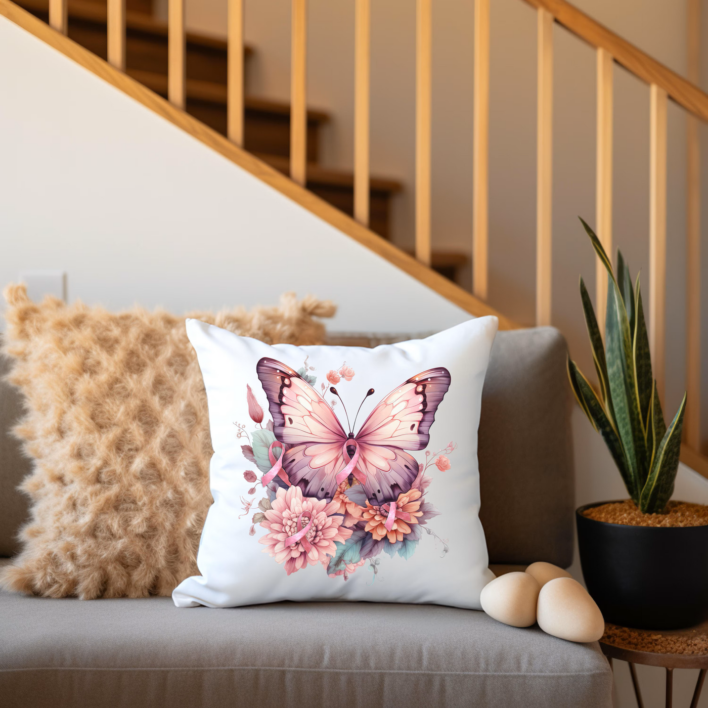 a white pillow with a pink butterfly on it