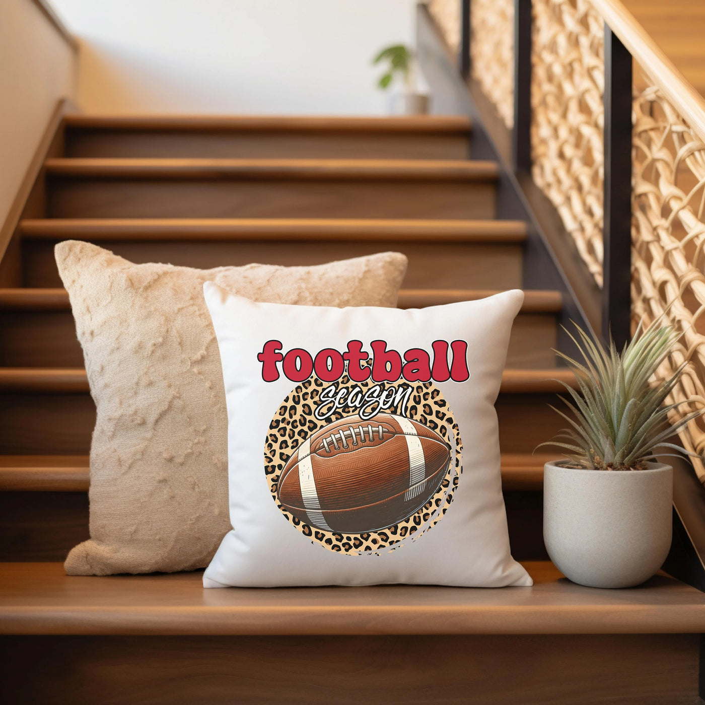 a football pillow sitting on top of a wooden banister