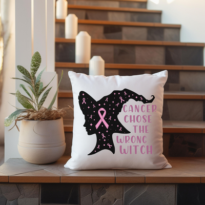 a pillow that has a pink ribbon on it