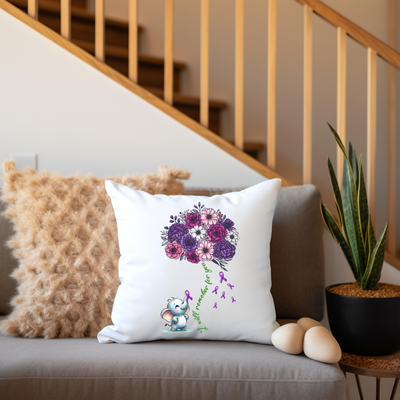 a couch with a pillow and a potted plant