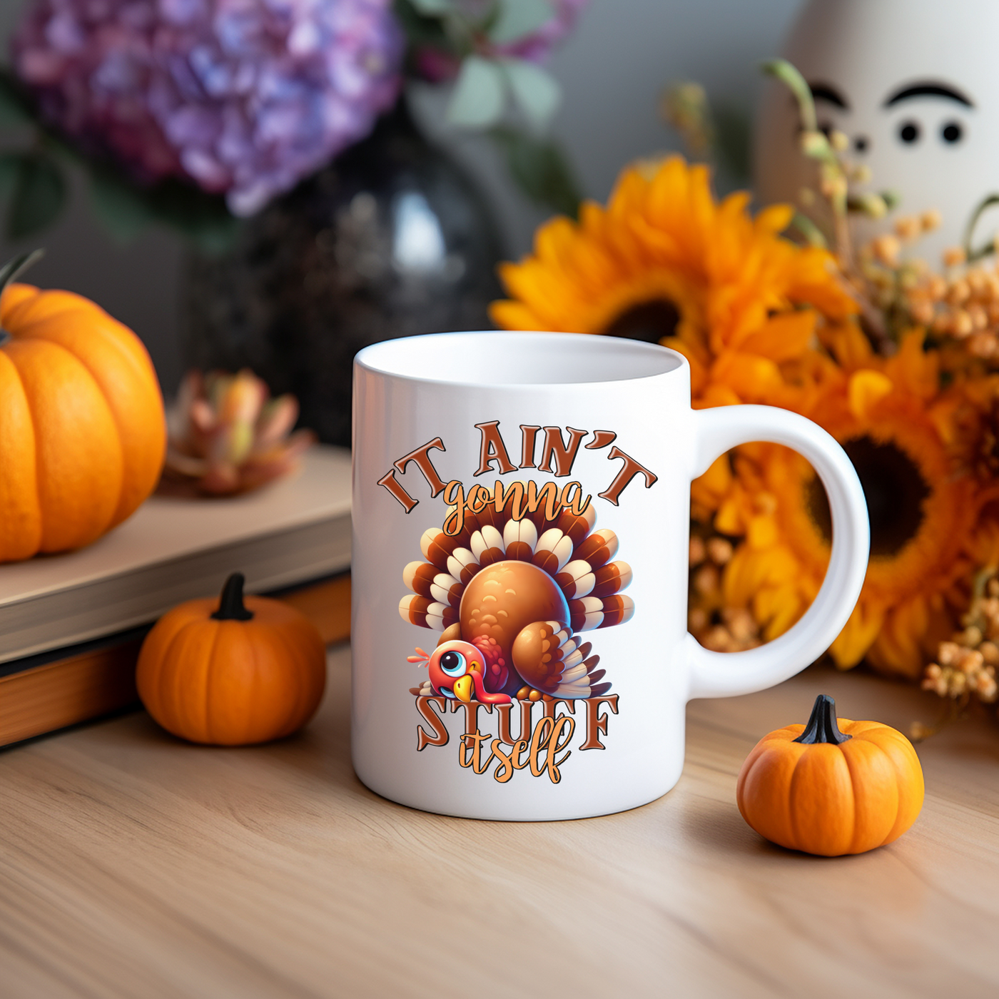 a white coffee mug sitting on top of a wooden table